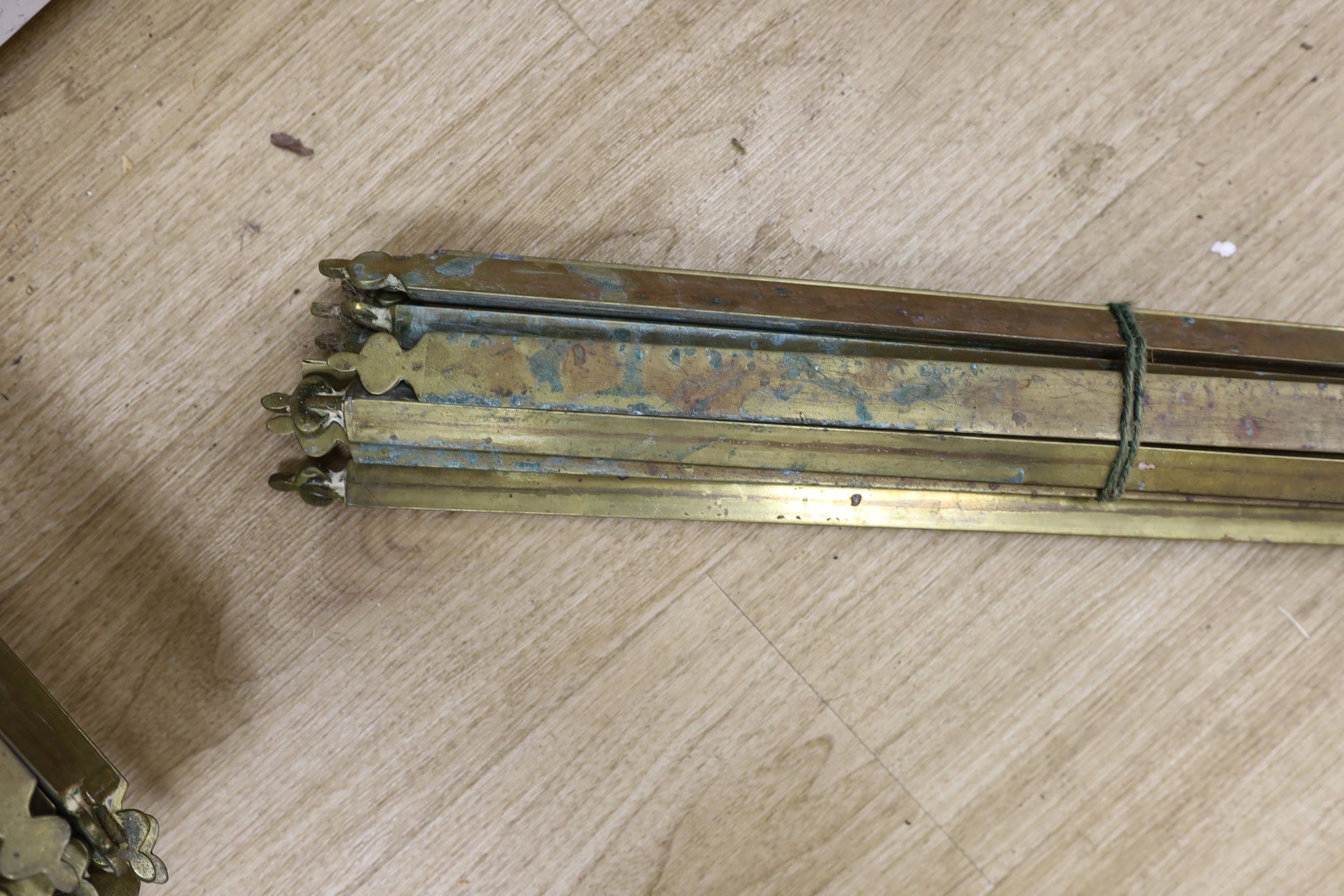 Two sets of brass stair rods with fittings.